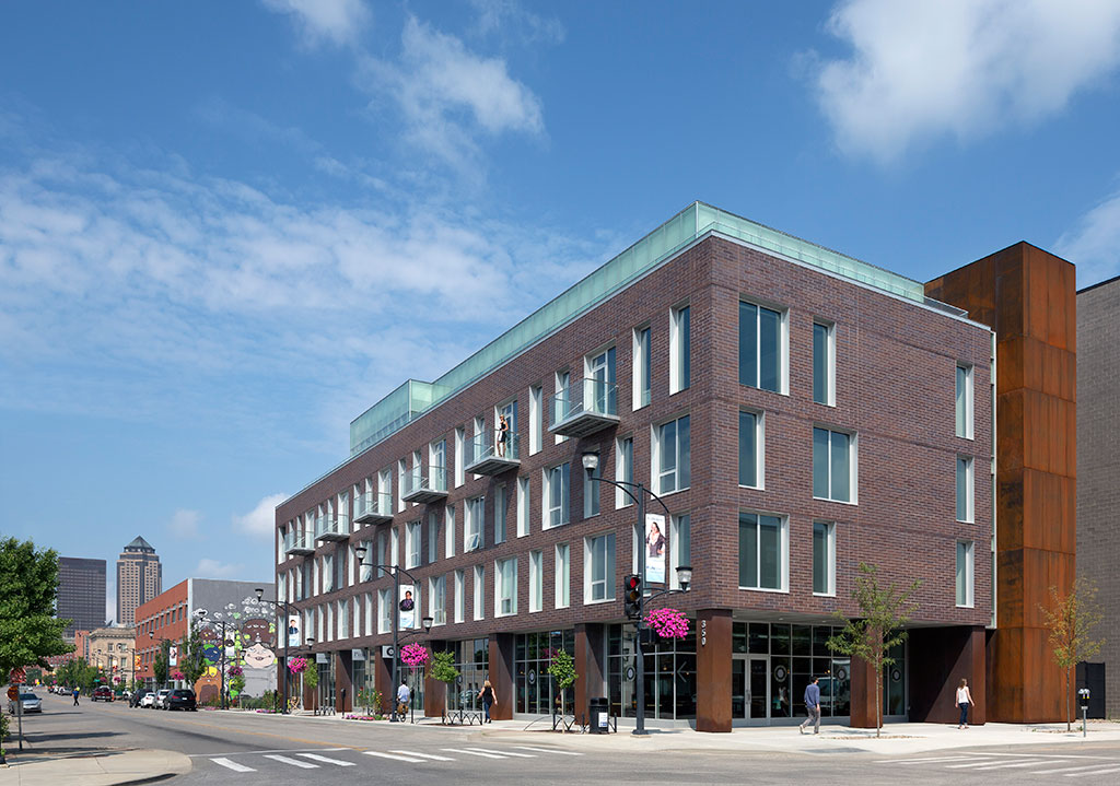 Exterior image looking east down locust street with 350 east locust in the foreground, along with the colorful art on the other buildings of the east village.